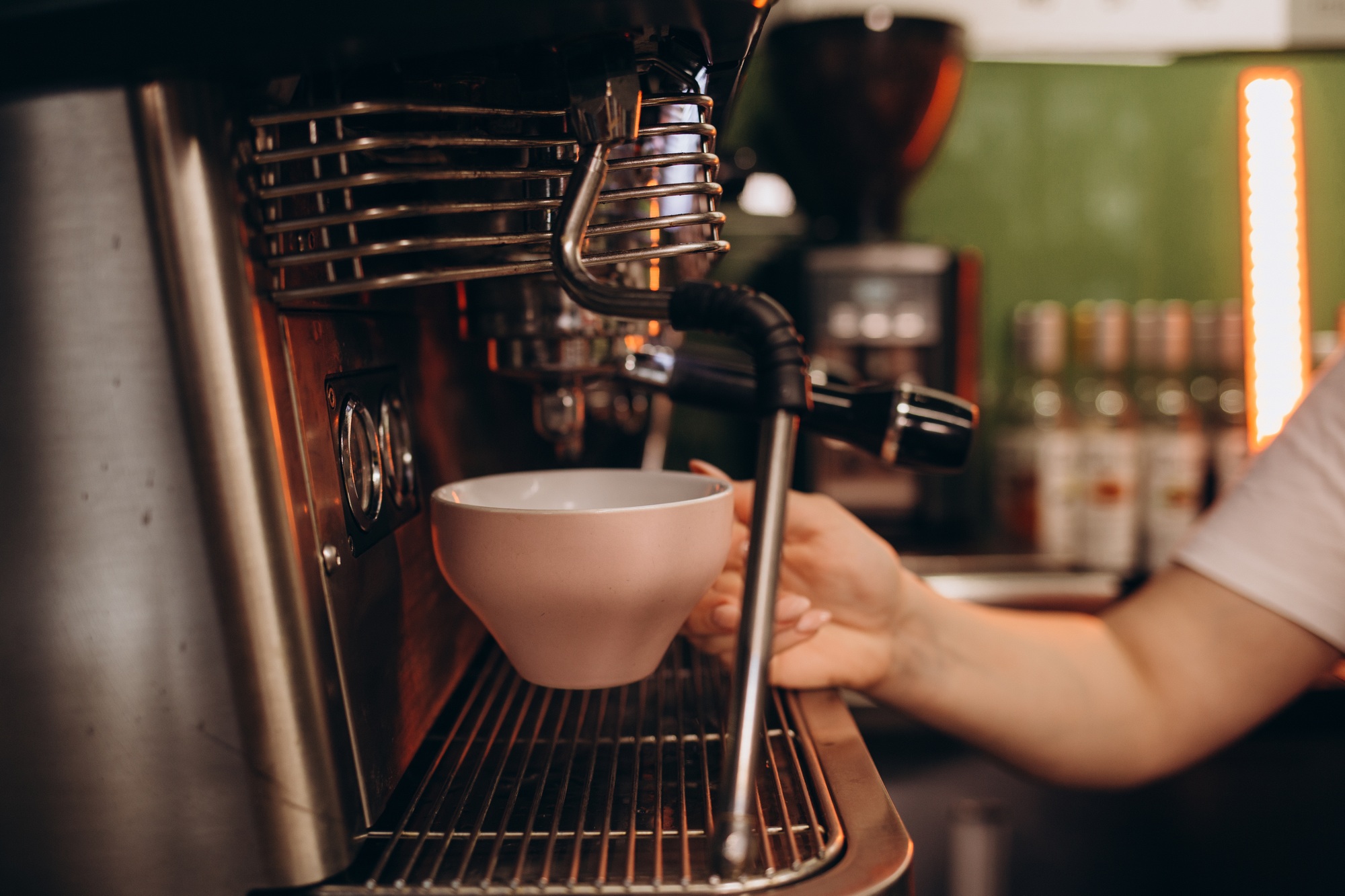 Maintenance, cleaning of coffee machine. Hot steam and water